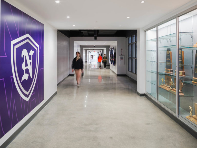 Hall of Fame corridor with wall graphic and trophy cases